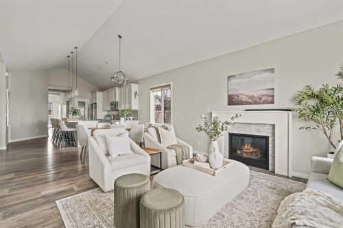 106-55 Fireside Circle, Cochrane, AB - Indoor Photo Showing Living Room With Fireplace