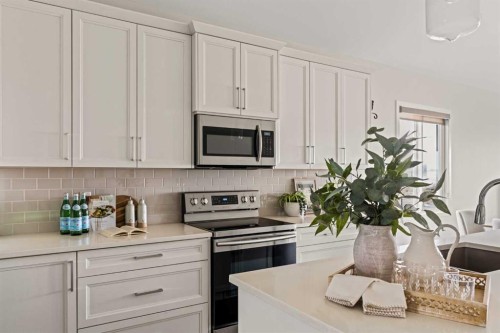 106-55 Fireside Circle, Cochrane, AB - Indoor Photo Showing Kitchen