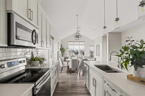 106-55 Fireside Circle, Cochrane, AB - Indoor Photo Showing Kitchen With Double Sink With Upgraded Kitchen