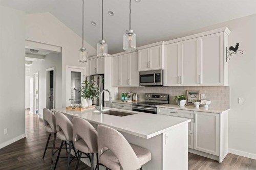 106-55 Fireside Circle, Cochrane, AB - Indoor Photo Showing Kitchen With Double Sink With Upgraded Kitchen