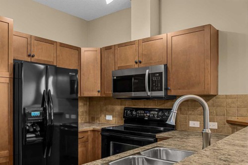 202-70 Dyrgas Gate, Canmore, AB - Indoor Photo Showing Kitchen With Double Sink