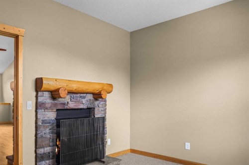 202-70 Dyrgas Gate, Canmore, AB - Indoor Photo Showing Other Room With Fireplace