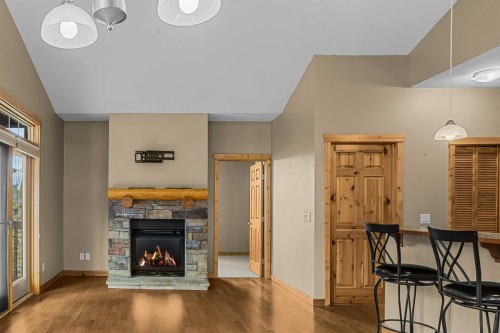 202-70 Dyrgas Gate, Canmore, AB - Indoor Photo Showing Living Room With Fireplace