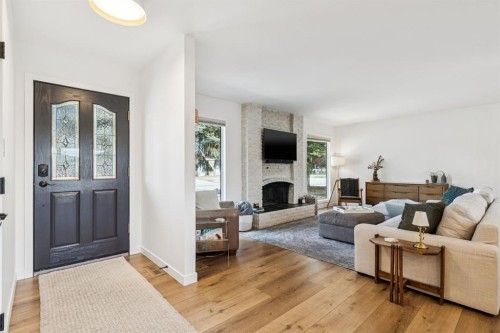 931 Parkwood Drive Se, Calgary, AB - Indoor Photo Showing Living Room With Fireplace