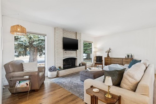 931 Parkwood Drive Se, Calgary, AB - Indoor Photo Showing Living Room With Fireplace