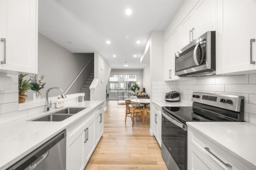 306 Evanscrest Square Nw, Calgary, AB - Indoor Photo Showing Kitchen With Stainless Steel Kitchen With Double Sink With Upgraded Kitchen