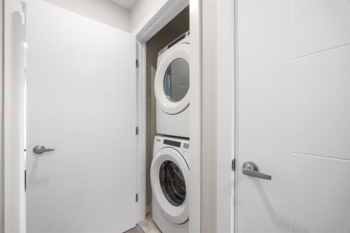 306 Evanscrest Square Nw, Calgary, AB - Indoor Photo Showing Laundry Room