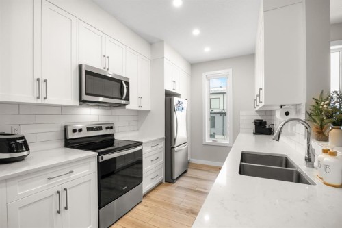 306 Evanscrest Square Nw, Calgary, AB - Indoor Photo Showing Kitchen With Stainless Steel Kitchen With Double Sink With Upgraded Kitchen