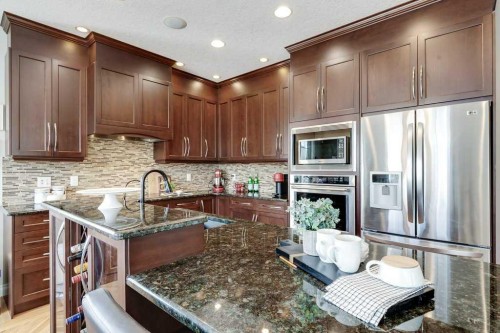279 Coopers Hill Sw, Airdrie, AB - Indoor Photo Showing Kitchen With Upgraded Kitchen