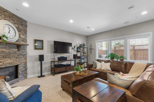 279 Coopers Hill Sw, Airdrie, AB - Indoor Photo Showing Living Room With Fireplace