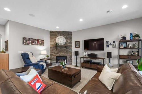 279 Coopers Hill Sw, Airdrie, AB - Indoor Photo Showing Living Room With Fireplace