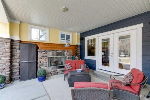 279 Coopers Hill Sw, Airdrie, AB - Outdoor With Fireplace With Deck Patio Veranda With Exterior
