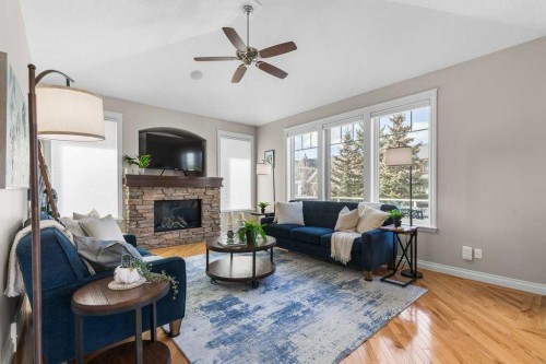 279 Coopers Hill Sw, Airdrie, AB - Indoor Photo Showing Living Room With Fireplace