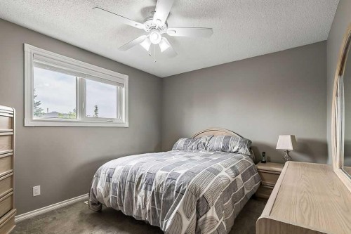 141 Shawfield Way Sw, Calgary, AB - Indoor Photo Showing Bedroom
