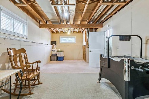 141 Shawfield Way Sw, Calgary, AB - Indoor Photo Showing Basement