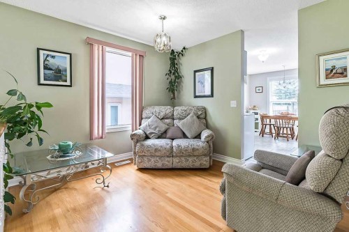141 Shawfield Way Sw, Calgary, AB - Indoor Photo Showing Living Room