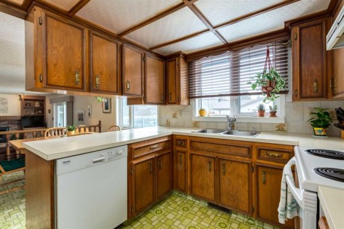 68 Silver Ridge Court Nw, Calgary, AB - Indoor Photo Showing Kitchen With Double Sink