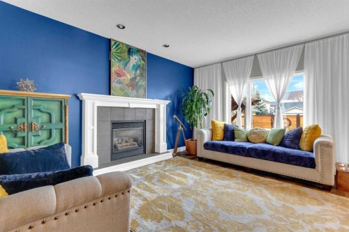 14 Inverness Close Se, Calgary, AB - Indoor Photo Showing Living Room With Fireplace