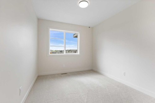12 Waterford Glen, Chestermere, AB - Indoor Photo Showing Other Room