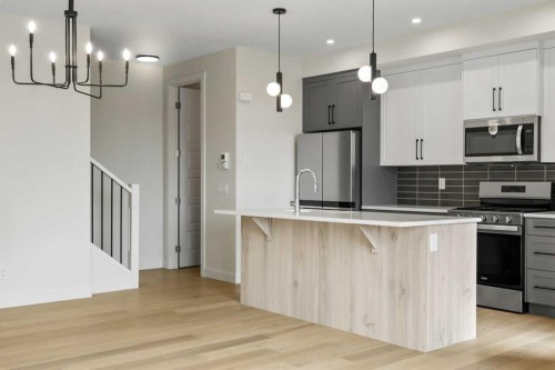 12 Waterford Glen, Chestermere, AB - Indoor Photo Showing Kitchen With Upgraded Kitchen