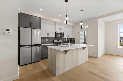 12 Waterford Glen, Chestermere, AB - Indoor Photo Showing Kitchen With Upgraded Kitchen