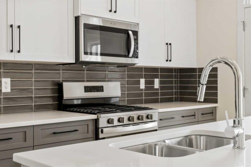 12 Waterford Glen, Chestermere, AB - Indoor Photo Showing Kitchen With Double Sink With Upgraded Kitchen