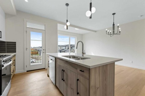 12 Waterford Glen, Chestermere, AB - Indoor Photo Showing Kitchen With Double Sink