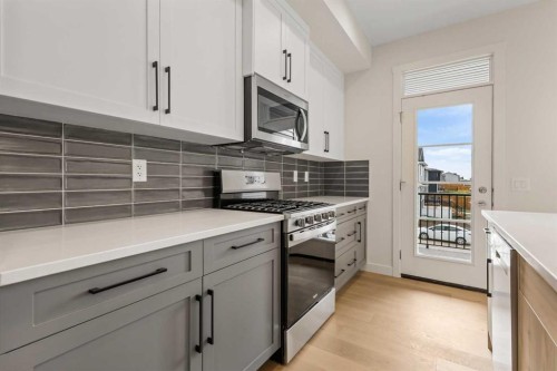 12 Waterford Glen, Chestermere, AB - Indoor Photo Showing Kitchen With Upgraded Kitchen