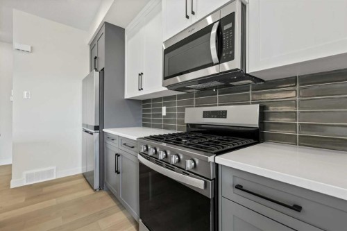 12 Waterford Glen, Chestermere, AB - Indoor Photo Showing Kitchen With Upgraded Kitchen