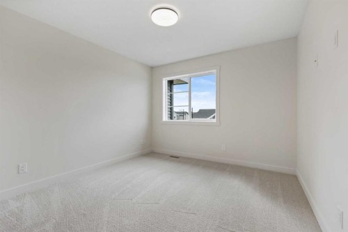 12 Waterford Glen, Chestermere, AB - Indoor Photo Showing Other Room