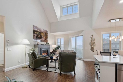 2410-15 Sunset Square, Cochrane, AB - Indoor Photo Showing Living Room With Fireplace