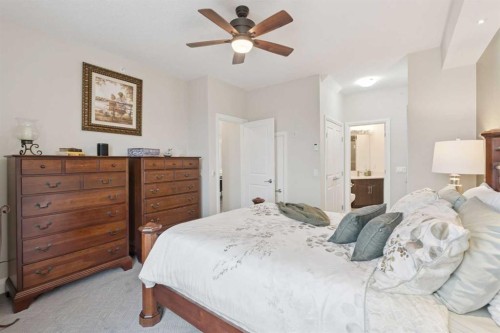 2410-15 Sunset Square, Cochrane, AB - Indoor Photo Showing Bedroom