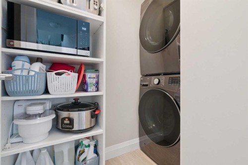 2410-15 Sunset Square, Cochrane, AB - Indoor Photo Showing Laundry Room