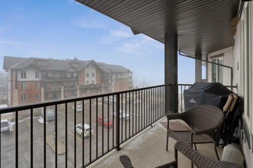 2410-15 Sunset Square, Cochrane, AB - Outdoor With Balcony With Exterior