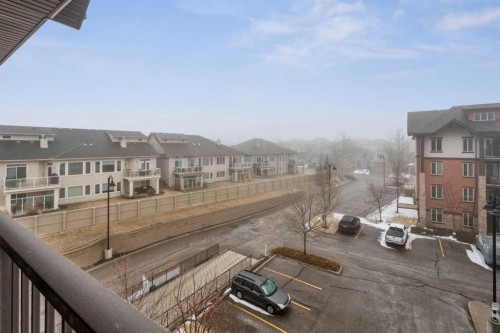 2410-15 Sunset Square, Cochrane, AB - Outdoor With Balcony