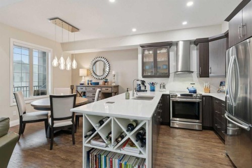 2410-15 Sunset Square, Cochrane, AB - Indoor Photo Showing Kitchen With Upgraded Kitchen