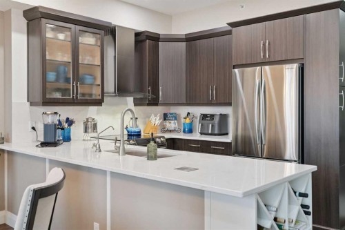 2410-15 Sunset Square, Cochrane, AB - Indoor Photo Showing Kitchen With Upgraded Kitchen