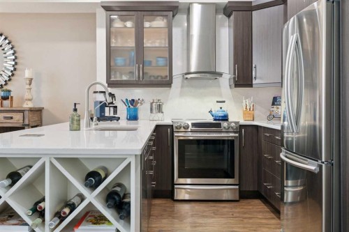 2410-15 Sunset Square, Cochrane, AB - Indoor Photo Showing Kitchen With Upgraded Kitchen