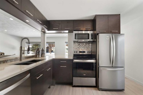 38 Westwood Drive Sw, Calgary, AB - Indoor Photo Showing Kitchen With Stainless Steel Kitchen With Double Sink