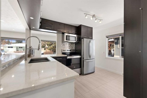 38 Westwood Drive Sw, Calgary, AB - Indoor Photo Showing Kitchen With Stainless Steel Kitchen With Double Sink With Upgraded Kitchen