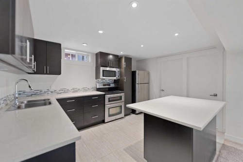 38 Westwood Drive Sw, Calgary, AB - Indoor Photo Showing Kitchen With Stainless Steel Kitchen With Double Sink With Upgraded Kitchen