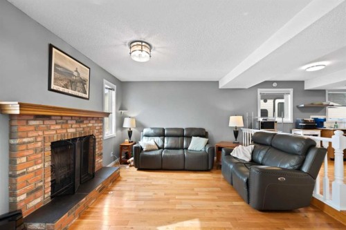 79 Macewan Meadow Rise Nw, Calgary, AB - Indoor Photo Showing Living Room With Fireplace