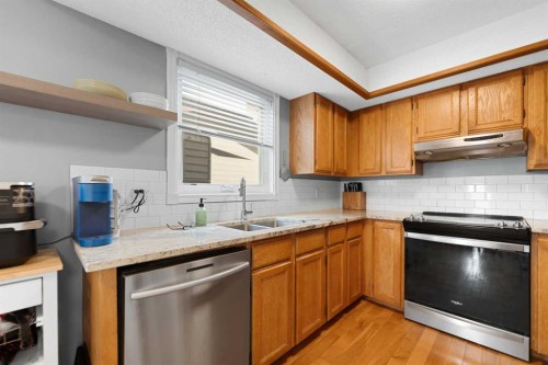 79 Macewan Meadow Rise Nw, Calgary, AB - Indoor Photo Showing Kitchen With Double Sink