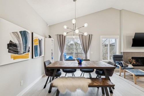 103 Walgrove Green Se, Calgary, AB - Indoor Photo Showing Dining Room With Fireplace