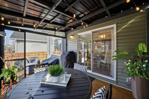 141 Willow Park, Cochrane, AB - Outdoor With Deck Patio Veranda With Exterior