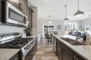 141 Willow Park, Cochrane, AB  - Indoor Photo Showing Kitchen With Double Sink With Upgraded Kitchen 
