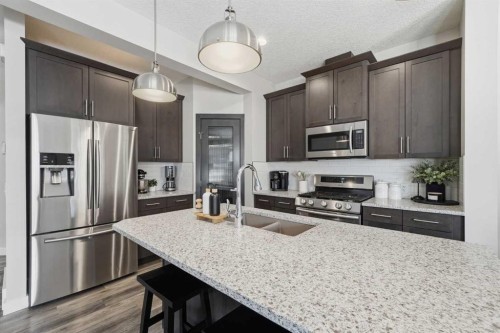141 Willow Park, Cochrane, AB - Indoor Photo Showing Kitchen With Stainless Steel Kitchen With Double Sink With Upgraded Kitchen