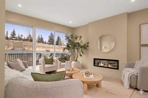152 Crimson Ridge Place, Calgary, AB - Indoor Photo Showing Living Room With Fireplace