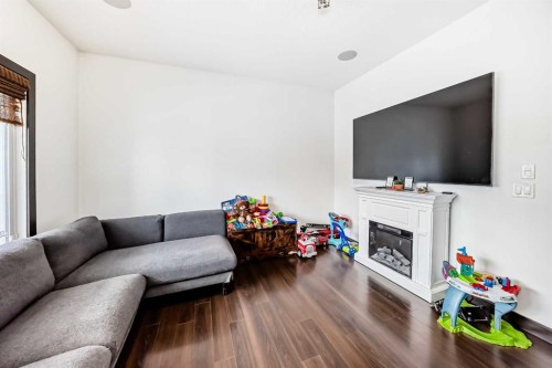 17 Redstone Common Ne, Calgary, AB - Indoor Photo Showing Living Room With Fireplace