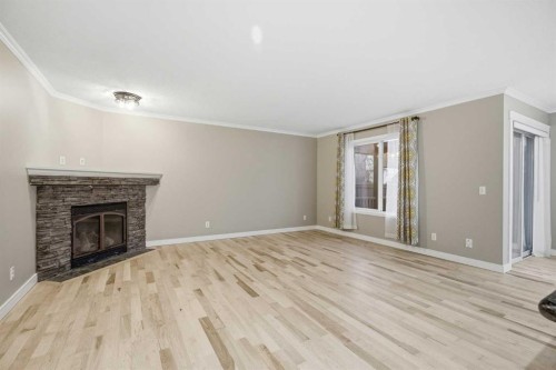 275 Chapalina Terrace Se, Calgary, AB - Indoor Photo Showing Living Room With Fireplace